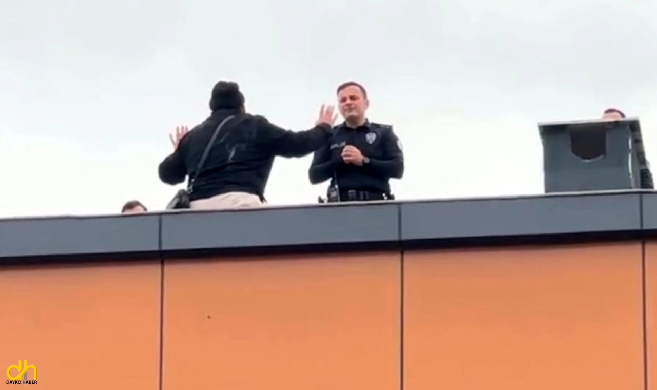 Çatıya çıkan kapıcıyı, başkomiser ikna etti