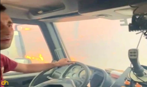 Arazöz orman yangınının ortasında kaldı